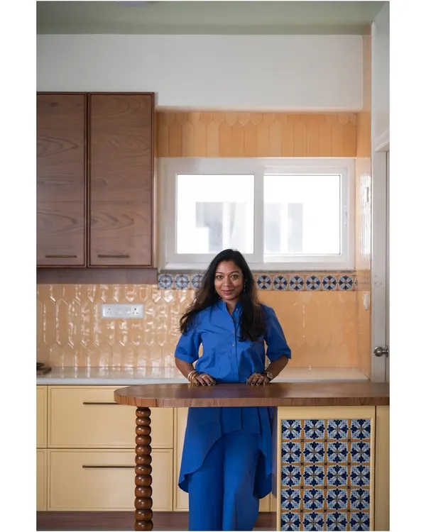 This is me in a recently completed kitchen, from our "Where Daffodils Dance" project. This project was a love letter to serenity, focusing on thoughtful simplicity and creating a sanctuary of peace and calm.
