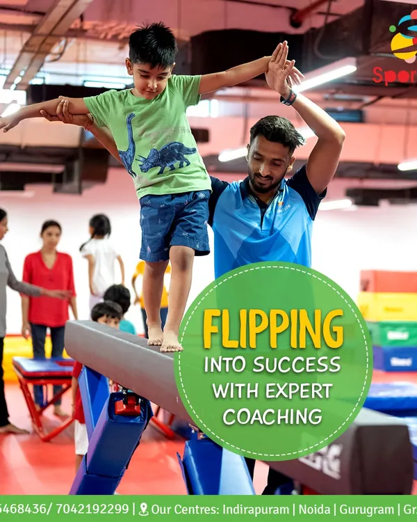 Flipping into success with expert coaching. This picture perfectly captures how our coaches provide hands-on support to help students learn new skills safely on the balance beam.