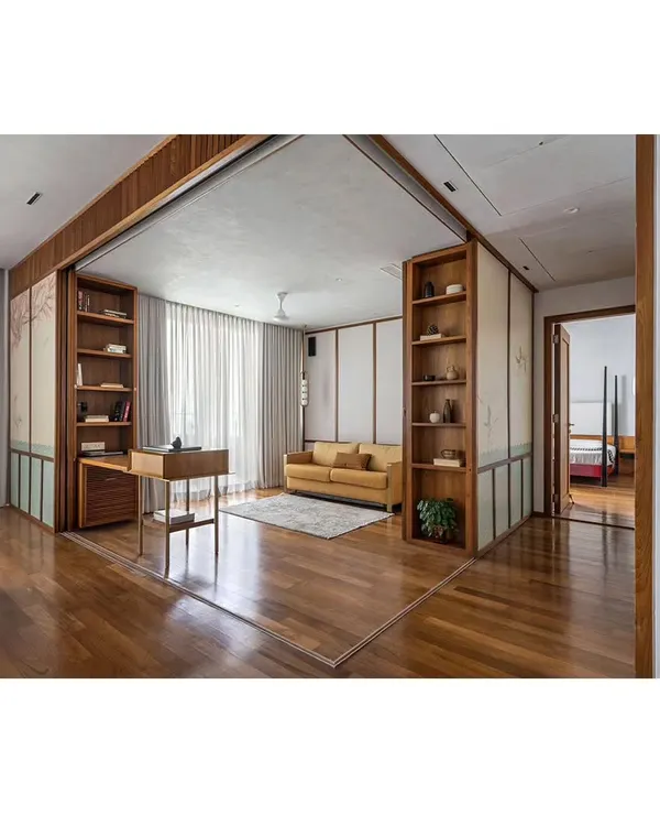 The 'Ikigai House' features large, sliding partitions that can completely transform the layout. Here, a study and lounge area is revealed, seamlessly integrated with the main living space, yet able to be closed off for privacy.