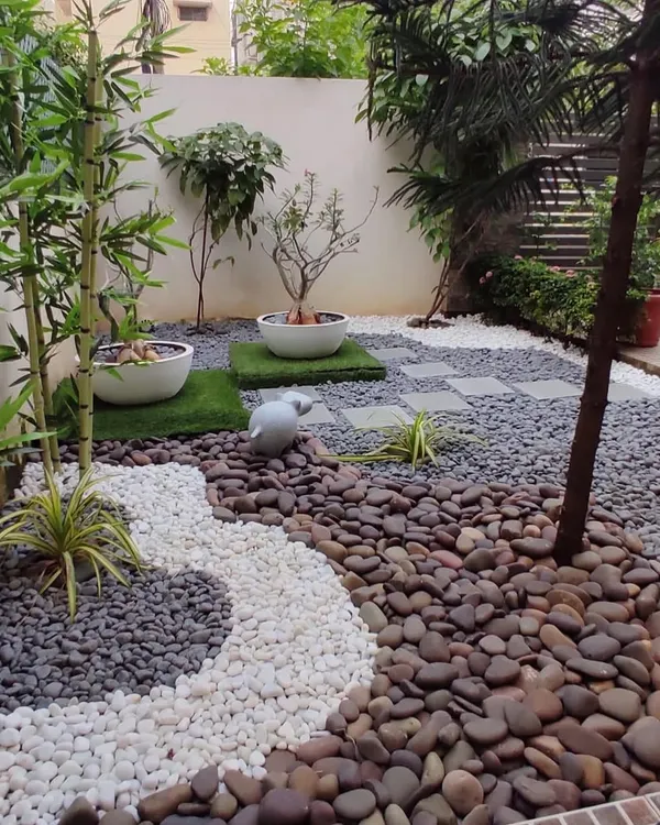 This is my favorite low-maintenance pebble garden. A garden isn't just about plants; using different colored and sized stones, we can create beautiful, flowing patterns that require almost no care.