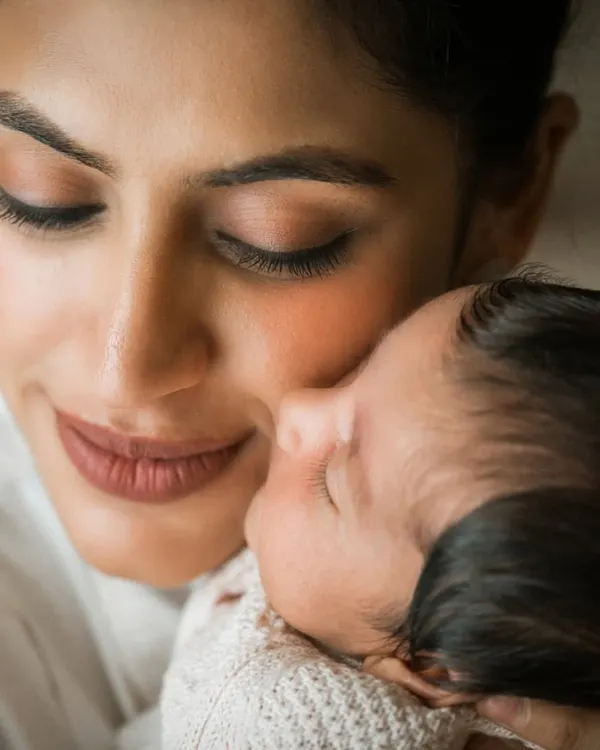 The purest love. This close-up of a mother and her newborn is what lifestyle photography is all about. It's not about the perfect pose, but the real, overwhelming emotion of holding your new baby.