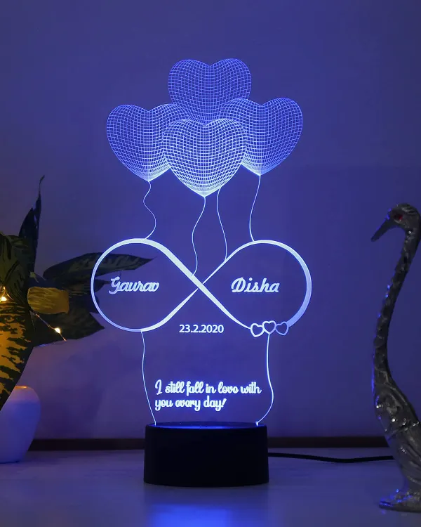 This 3D illusion lamp creates a stunning visual effect, customized with your names and a special date inside an infinity symbol. It's an incredibly romantic gift for a wedding or anniversary.