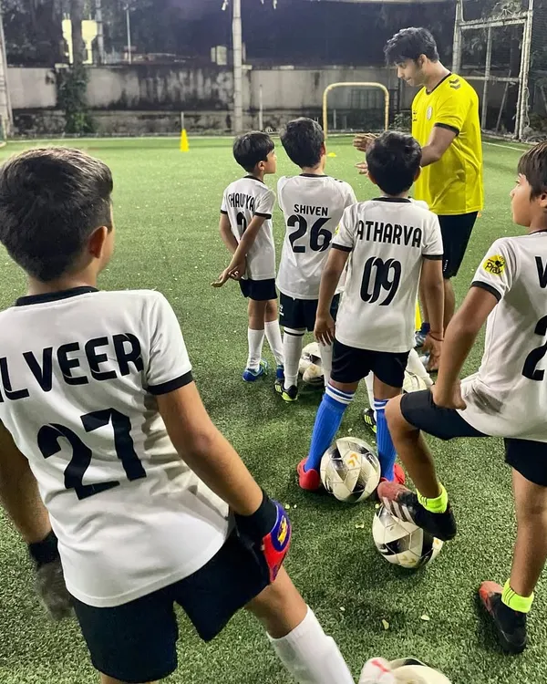 A coach gives tactical instructions to our U10 team. In our advanced groups, we focus on game intelligence, positioning, and a deeper understanding of strategy.