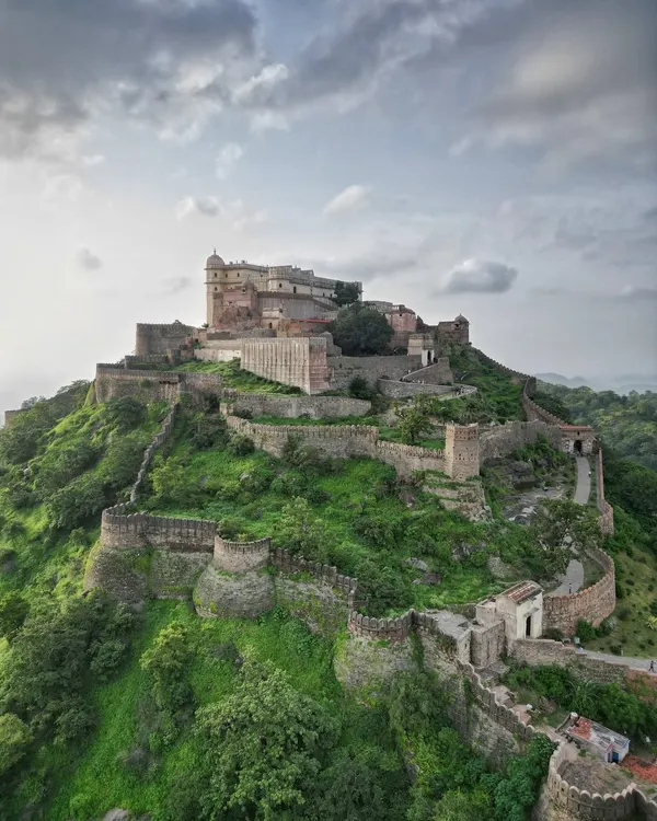 This is Kumbhalgarh Fort, home to the world's second-longest wall. As a certified drone pilot, I capture these sprawling heritage sites from perspectives that reveal their true scale and grandeur against the Aravalli hills.