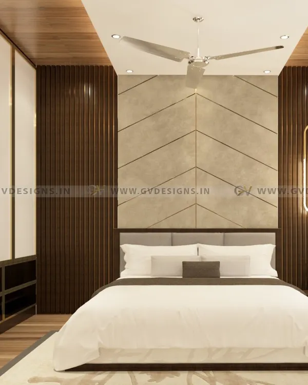 This luxurious bedroom design features a fabric headboard set against a laminate back wall with a sleek T-profile and PVC rafters. The wardrobe combines a gold-color aluminum frame with white and tinted black lacquered glass for a truly opulent feel.