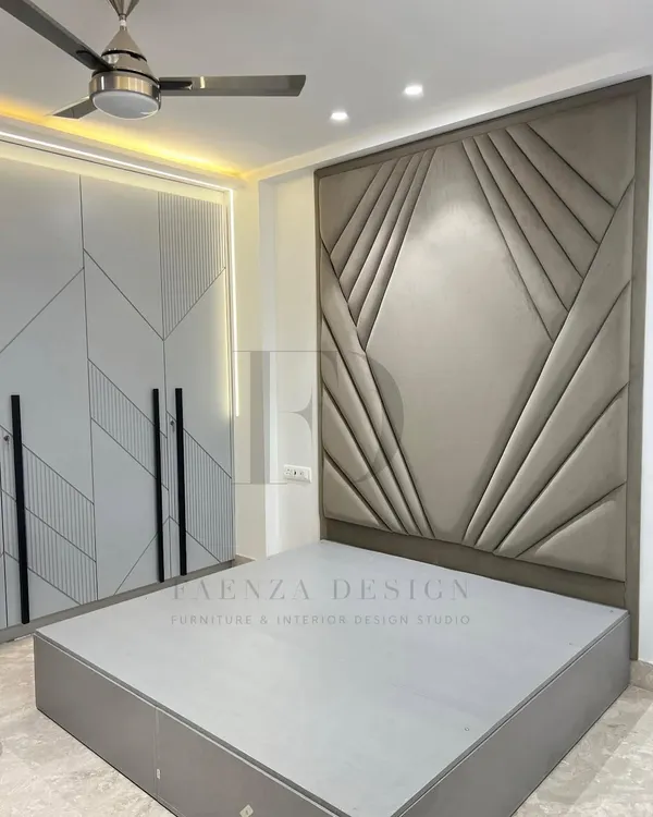 A true masterpiece of craftsmanship. This bedroom features a floor-to-ceiling headboard with a stunning geometric, Art Deco-inspired upholstered design, creating a dramatic and luxurious focal point.