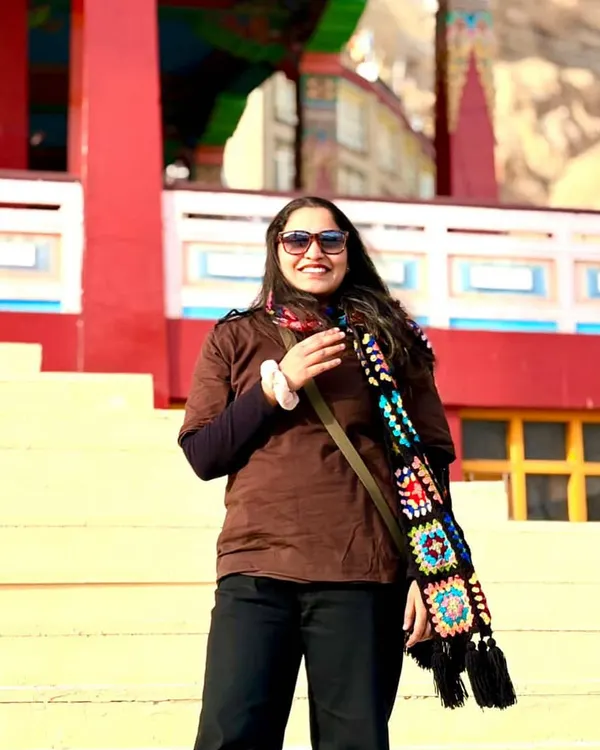 We love seeing our creations travel. A happy customer staying warm and stylish in Ladakh with our granny square muffler.