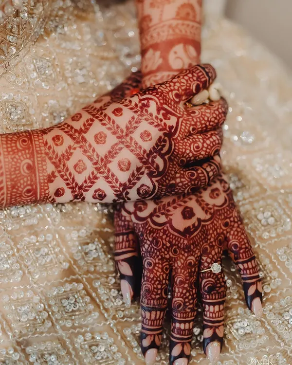 The deep, rich color of the mature henna stain is a result of high-quality, natural ingredients and proper aftercare. This close-up shows the beautiful contrast of the design on the skin.