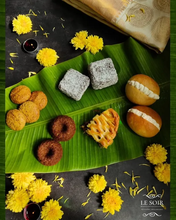 This is a glimpse of my 'Nandi 2024' Onam menu, a special collection I created to thank my wonderful Malayali clients. It features fusion bakes like Unniappam cakes, Butter Buns, and Masala Biscuits.