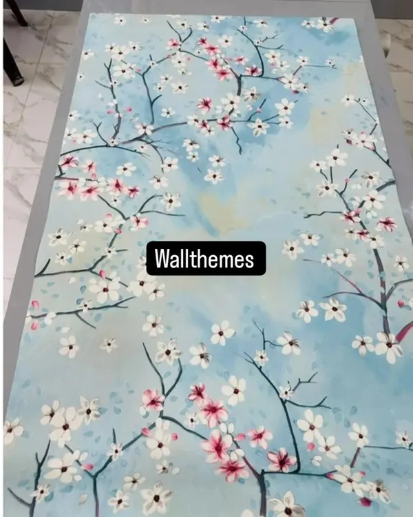 A beautiful cherry blossom wallpaper design with white and pink flowers on a sky-blue background, shown laid out flat.