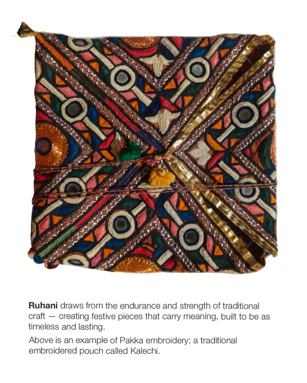 This is a traditional 'Kalechi' pouch, an example of our intricate Pakka embroidery. Each dense stitch reinforces the fabric, creating a festive piece that is both timeless and lasting, drawing from the strength and endurance of traditional Rajasthani craft.
