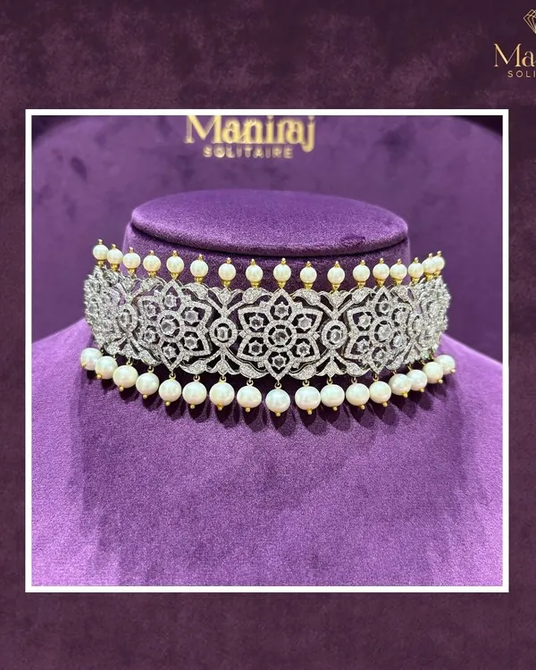 Turn heads with this exquisite diamond and pearl choker. The intricate floral filigree work is designed to make a statement, perfect for a modern bride or a grand gala.