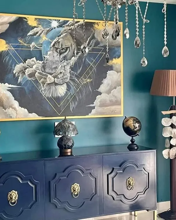 "The Stare." This commissioned acrylic on canvas painting was designed to be a powerful and dramatic centerpiece for a client's home. The surreal composition blends the face of a lion with clouds and geometric lines, creating a sense of strength and mystery.