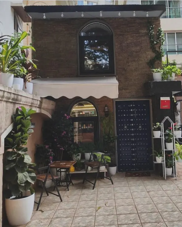 Welcome to our studio. We've created a space where you can relax, surrounded by greenery, before you step inside for your transformation.
