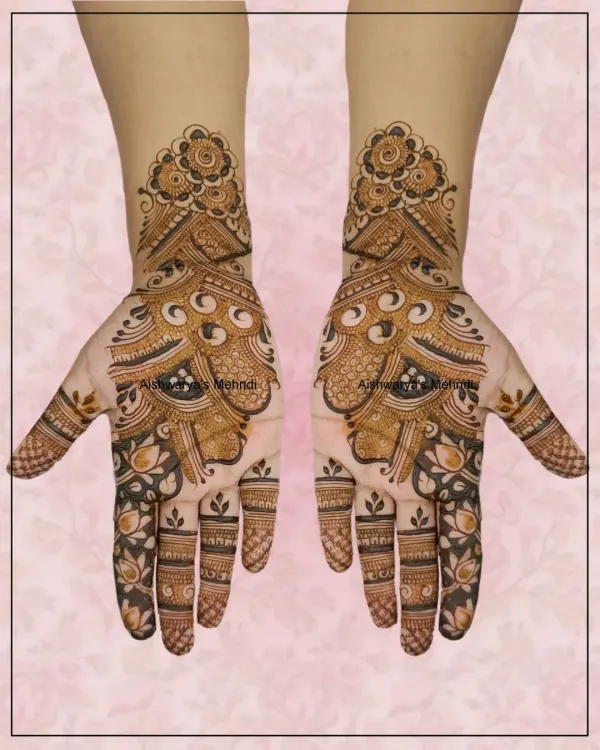 A beautiful Arabic mehndi design featuring a large peacock-inspired motif that flows from the palm to the wrist, combined with delicate floral details.