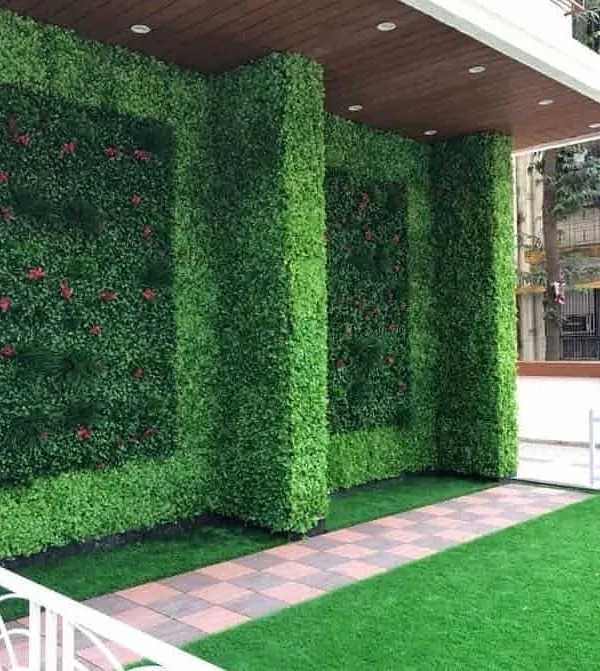 This is how you make a grand entrance. I covered the entire front facade of this building with a vertical garden, including inset panel designs. It completely transforms the property's curb appeal.