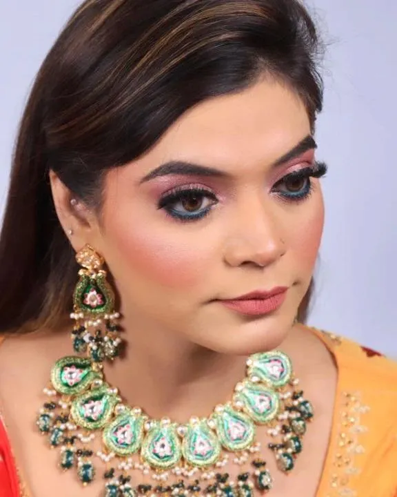 A close-up of a colorful party look. I used a blend of pink and blue eyeshadows to create a vibrant eye, balanced with a neutral lip color and defined brows.