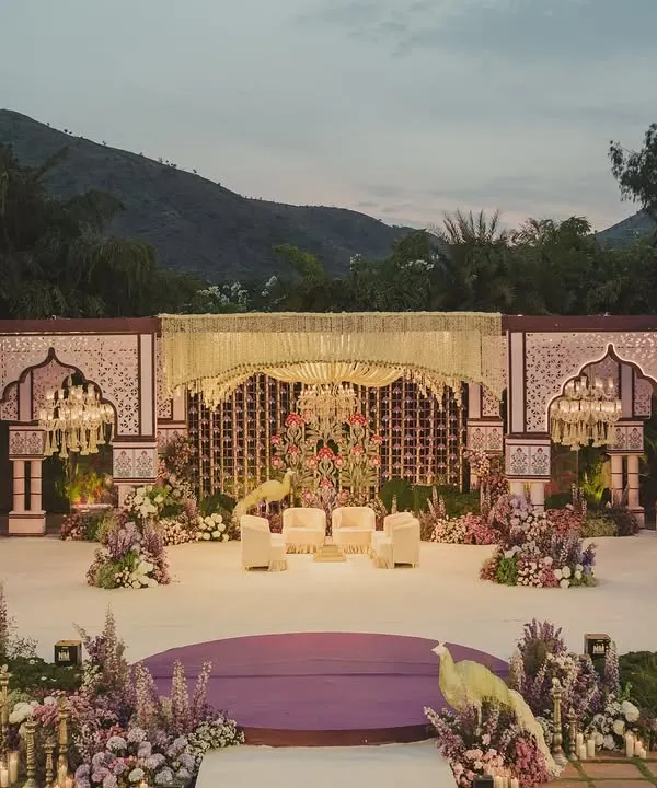 The brief was to bring Vrindavan to Udaipur. We created this breathtaking mandap against the Aravalli hills, using intricate architecture and lush florals to craft a sacred space that felt both grand and spiritual.