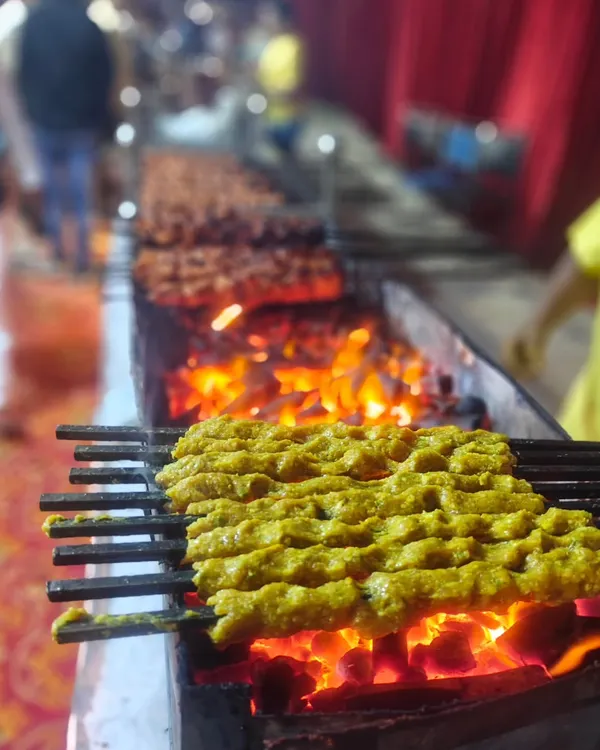 Our seekh kebabs, grilled fresh over hot coals right at your event. This is the real zayka of Purani Dilli, made with our special masalas that everyone loves.