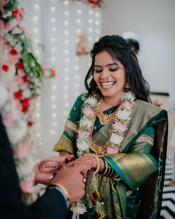 A moment of pure, unscripted laughter from the bride-to-be during her engagement ceremony. These are the genuine emotions I strive to capture.