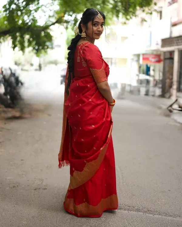 Wishing everyone a happy Ganesha Chaturthi with this traditional look. This is a full view of my vibrant red saree, perfect for the festive season. The rich color and gold border make it a classic choice.