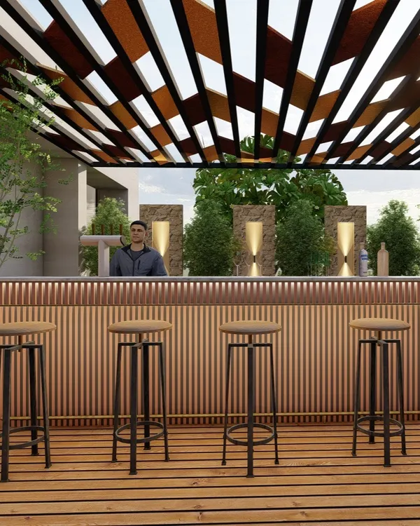 A sleek and modern rooftop bar we designed, featuring a slatted wood bar front and a striking geometric pergola. This space is perfect for entertaining, combining functionality with high-end design against a backdrop of lush greenery.