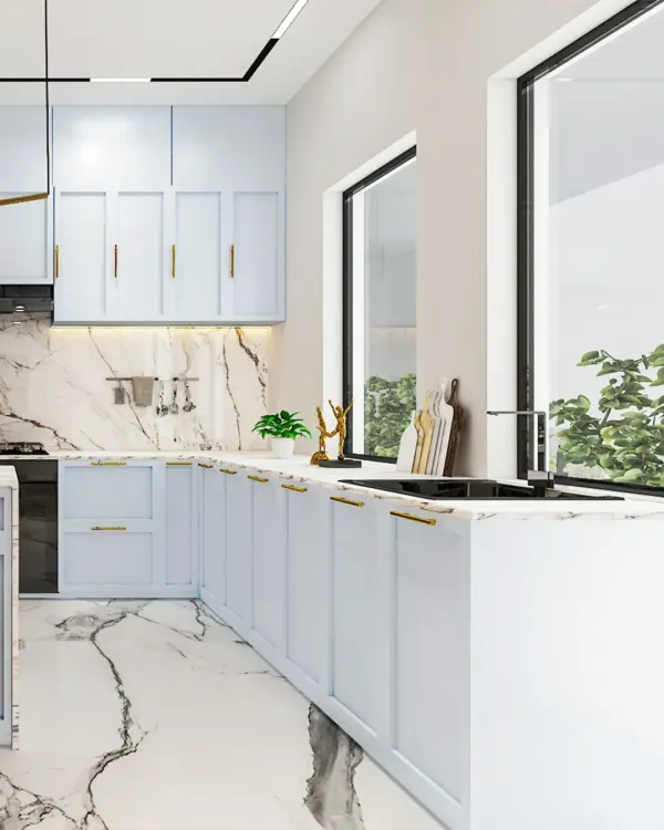 A seamless blend of soft pastels and marble finishes. This L-shaped kitchen design maximizes counter space and storage while maintaining a bright and airy feel, thanks to the large windows.