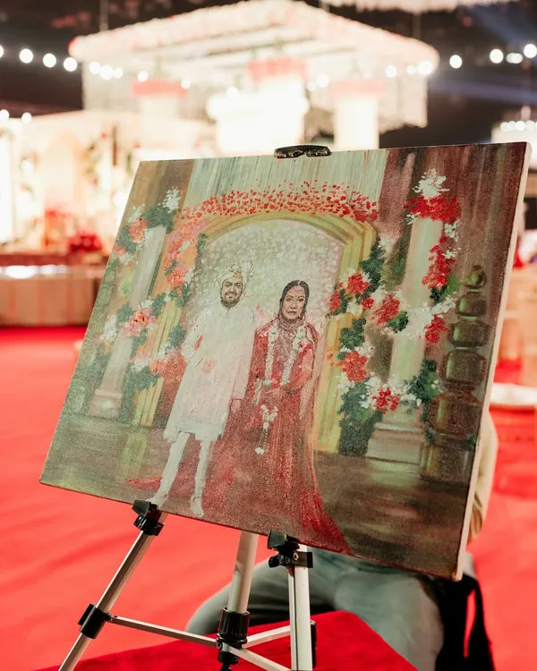 Bringing the varmala to life with live painting. I arranged for an artist to capture the ceremony on canvas, creating a timeless masterpiece and a unique entertainment experience for guests.