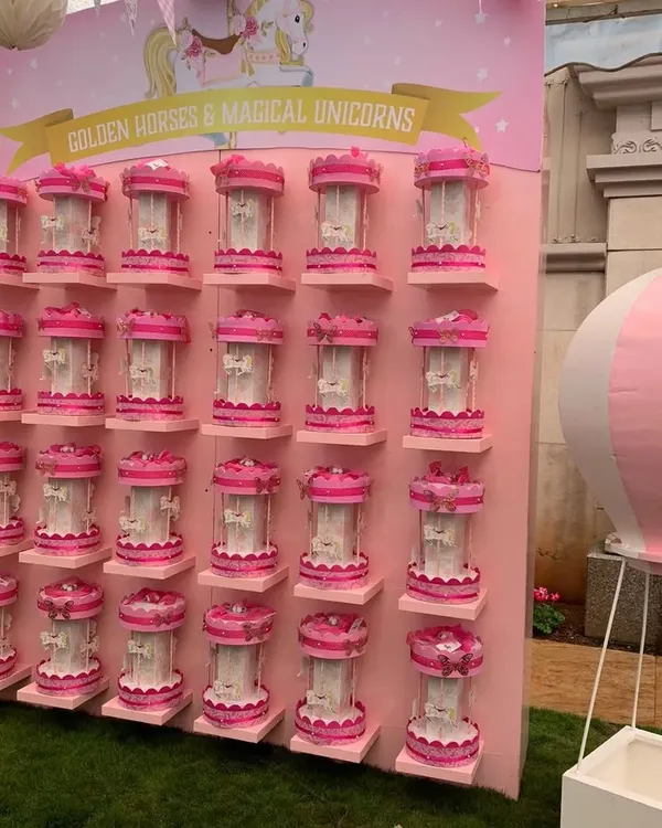 For a carousel-themed party, I designed this beautiful display wall for the party favors. Each guest got to take home their own miniature carousel, presented on custom-built shelving that was part of the overall decor.