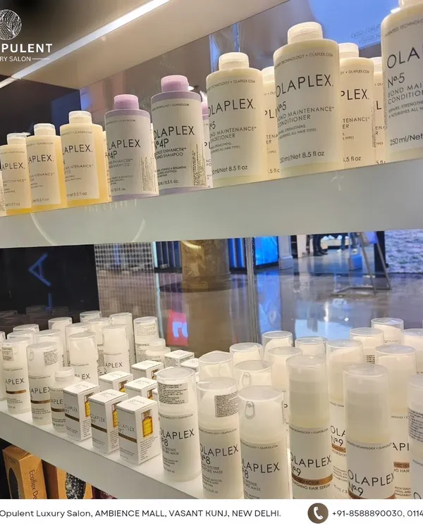 A shelf stocked with Olaplex products. I use these to repair, protect, and strengthen your hair during and after chemical services.