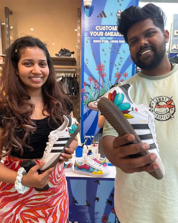 Us with a happy customer at our Adidas customization event. We painted these Adidas Sambas with a vibrant, nature-inspired floral design, creating a unique pair right in the store.