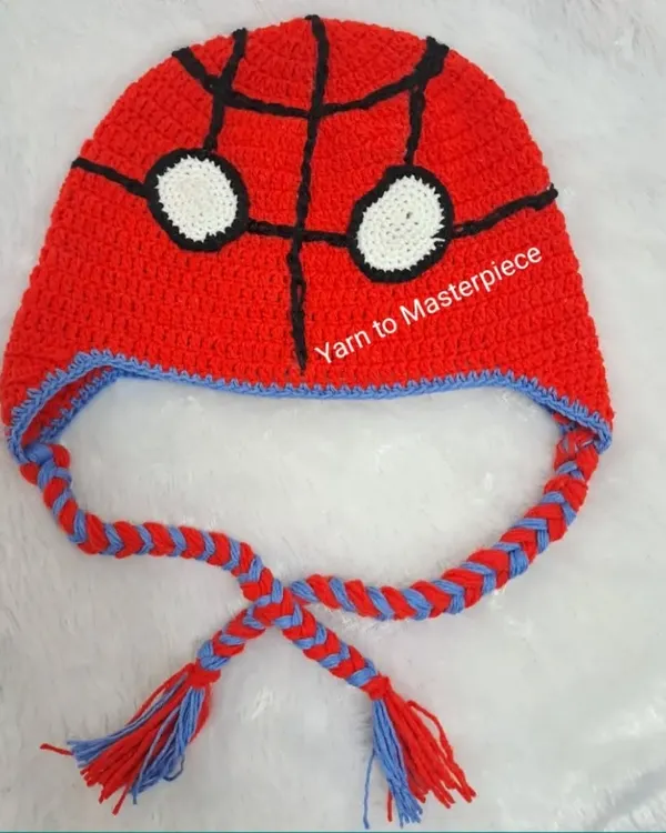 Your friendly neighborhood Spider-Man, in beanie form. This handmade crochet beanie features the iconic web design and eyes, with braided ear flaps to keep little ears warm.