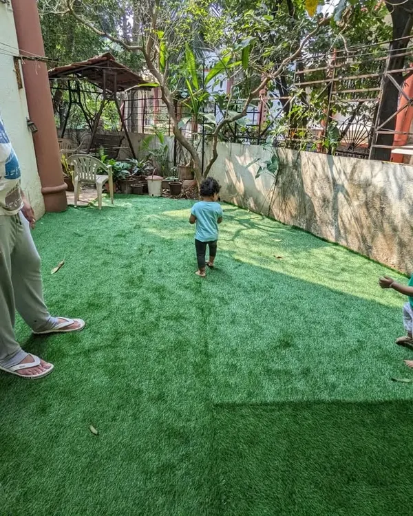The final result of a backyard makeover. What was once a bare patch of soil is now a safe and beautiful Paspalum grass lawn, perfect for the client's children to play on.