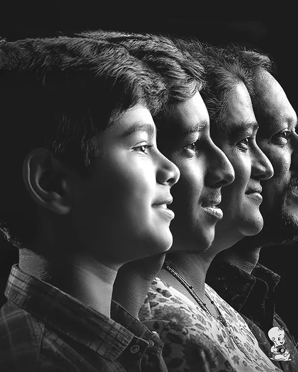 A beautiful and timeless family portrait. This side-profile shot in black and white shows the connection across generations, creating a powerful and artistic family heirloom.