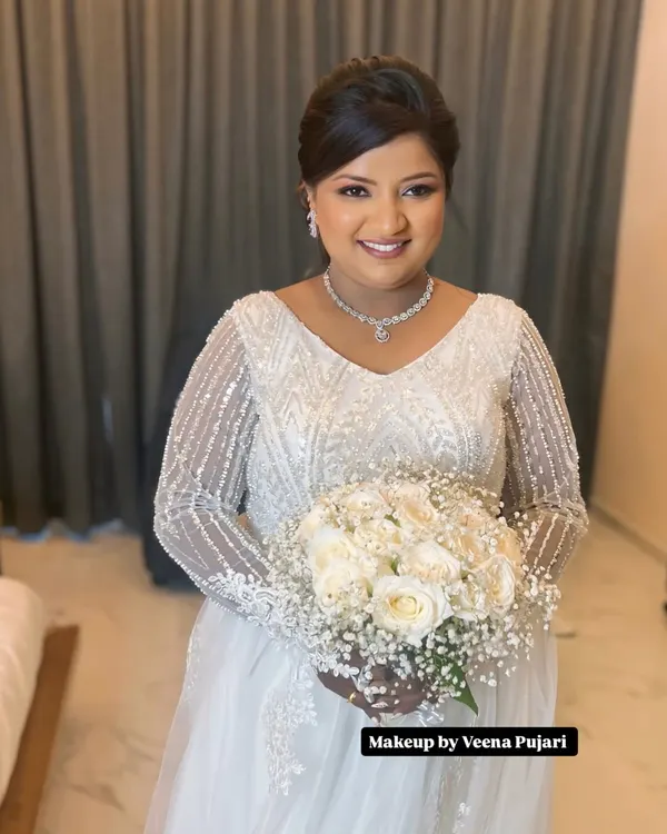 A beautiful and happy bride ready for her church wedding. I created a soft, radiant look with a classic updo to perfectly complement her stunning white gown and bouquet.
