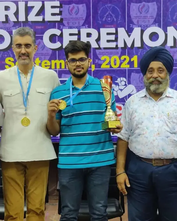 One of our academy's shooting stars with his gold medal and champion's trophy in the 10m Air Pistol event. It's a pleasure to see our shooters reach the top of the podium.