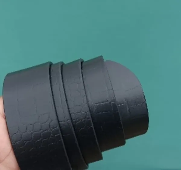 A close-up of my black leather belt, showing the subtle honeycomb texture of the crocodile-style leather.