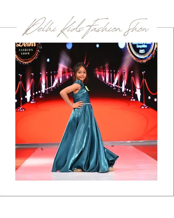 This is the kind of show-stopping moment I love to capture. This young model owns the runway in a stunning teal satin gown, striking a confident pose that perfectly showcases the dress's design and her personality. It’s a powerful shot that makes a fantastic centerpiece for any child's fashion portfolio.