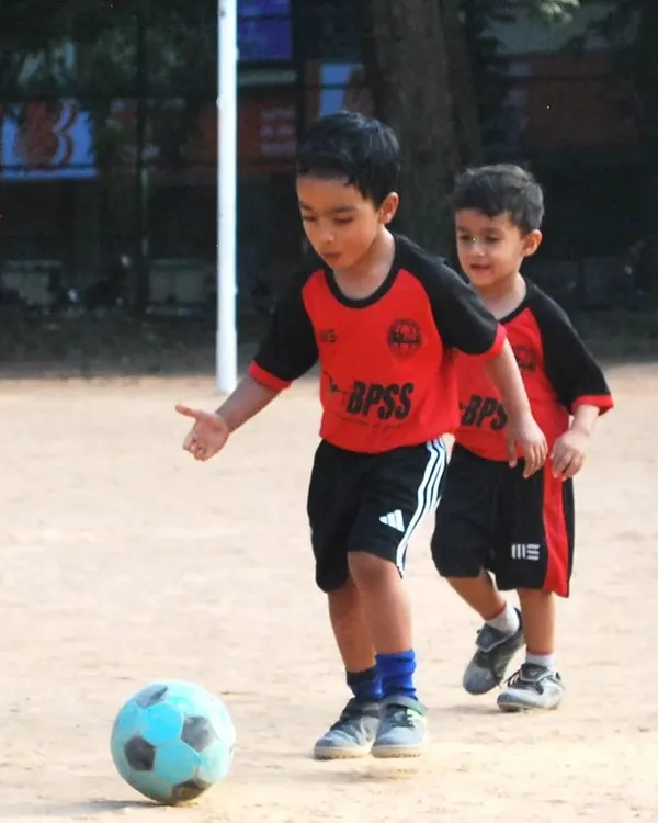 Little feet, big passion. My toddler program is all about introducing the beautiful game through fun and play. Here, two of our youngest players are completely focused on the ball, learning the basics of control and movement.