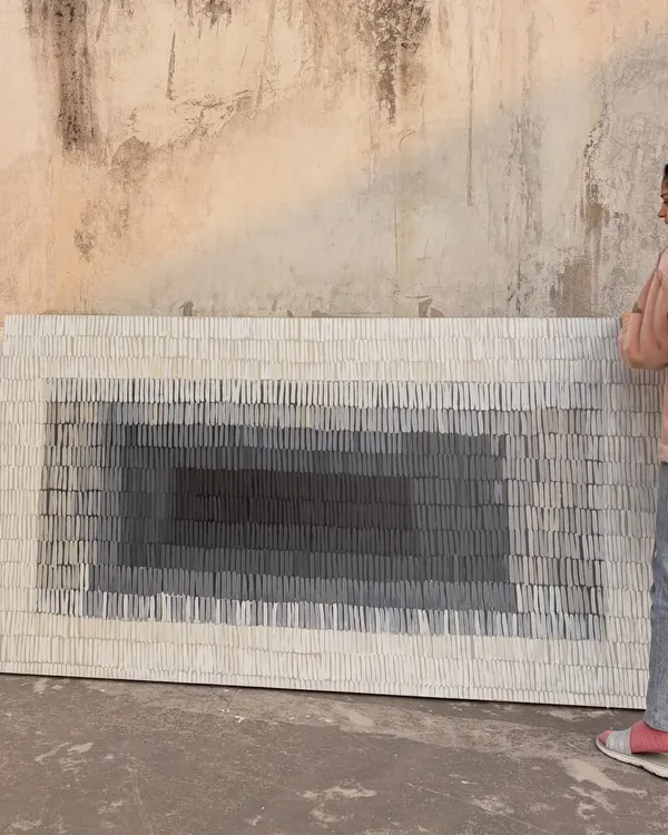 Here I am with a massive 8ft x 4ft textured canvas created for a home in Gujarat. The piece features thousands of individual textured strokes that create a gradient effect, drawing you into its depths.