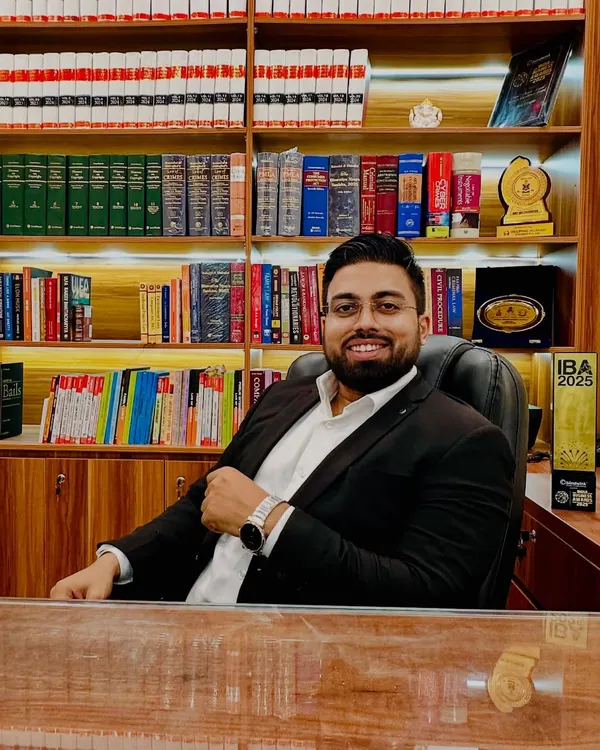 In my office, surrounded by the tools of my trade. Every book on these shelves represents knowledge that I use to build strong cases and secure justice for my clients.