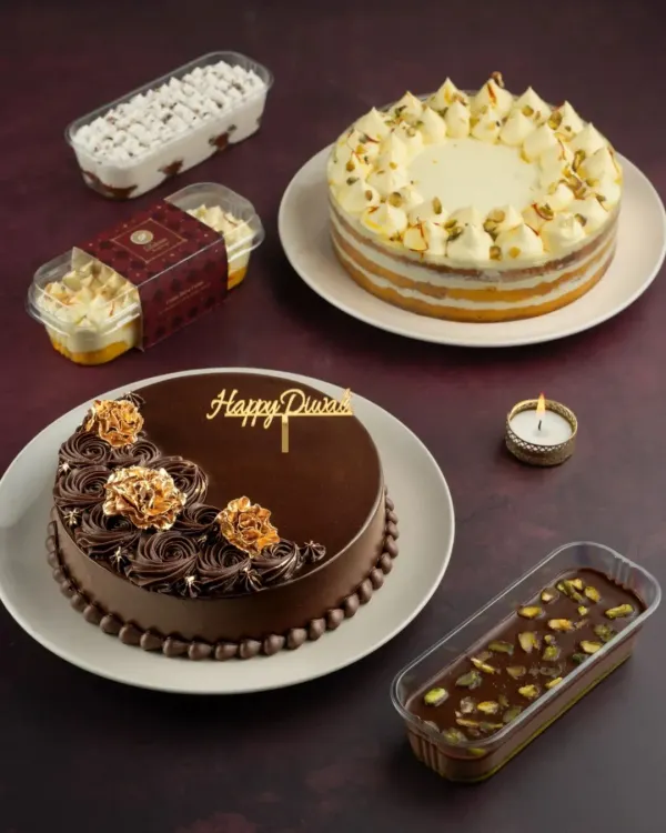 Our Diwali collection features a range of indulgent, fusion cakes and desserts in beautifully crafted gift boxes. Here you can see our Kesar Pista Tres Leches, a festive chocolate cake, and our dessert tubs.