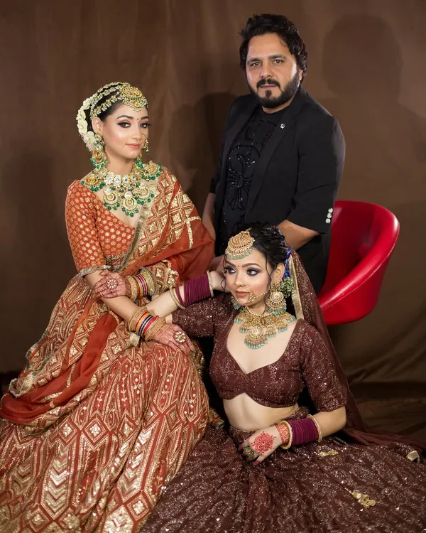 A proud moment with two of my beautiful brides in the studio. It's always a joy to see my vision come to life and to be a part of their special day.