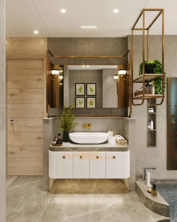 This vanity area combines a sleek white basin with a custom-designed mirror and brass-finished shelving, creating a look that is both modern and timeless.