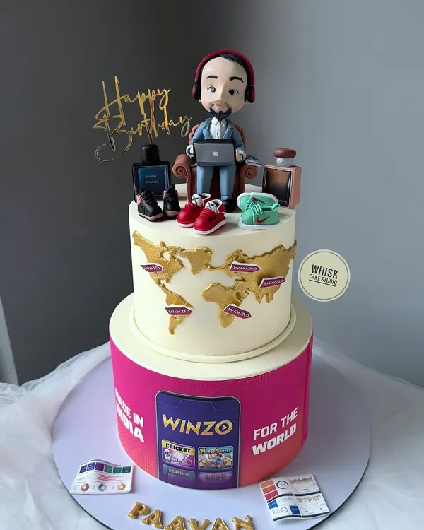 A special cake for the co-founder of Winzo and Zostel. This personalized cake features a caricature of him, his favorite things, and logos of his companies, telling his entrepreneurial story.