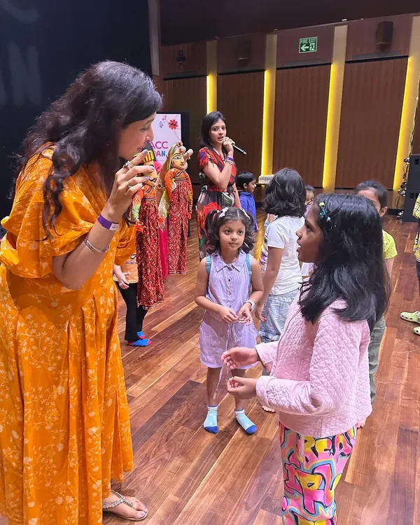 Our co-founder Kamakshi interacts with young participants at the "Folk Music of India" workshop. She is using traditional Rajasthani puppets to make the storytelling and musical experience more visual and engaging for the children.