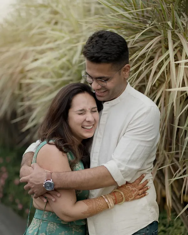 A warm, happy hug filled with genuine laughter. This is the kind of comfortable, easy love I aim to capture in my candid couple photography.