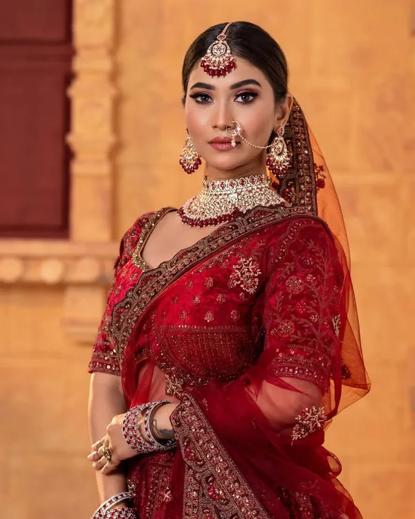 A stunning North Indian bridal look we created for a demonstration. The deep red velvet lehenga, kundan jewellery, and smokey eye makeup create a look of pure royalty.