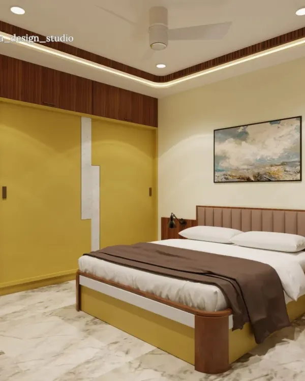 This bedroom design uses a warm palette of mustard yellow and rich wood tones to create a cheerful and inviting atmosphere. The sliding wardrobe with a modern white accent provides ample storage, while the cove lighting in the ceiling adds a soft, ambient glow.
