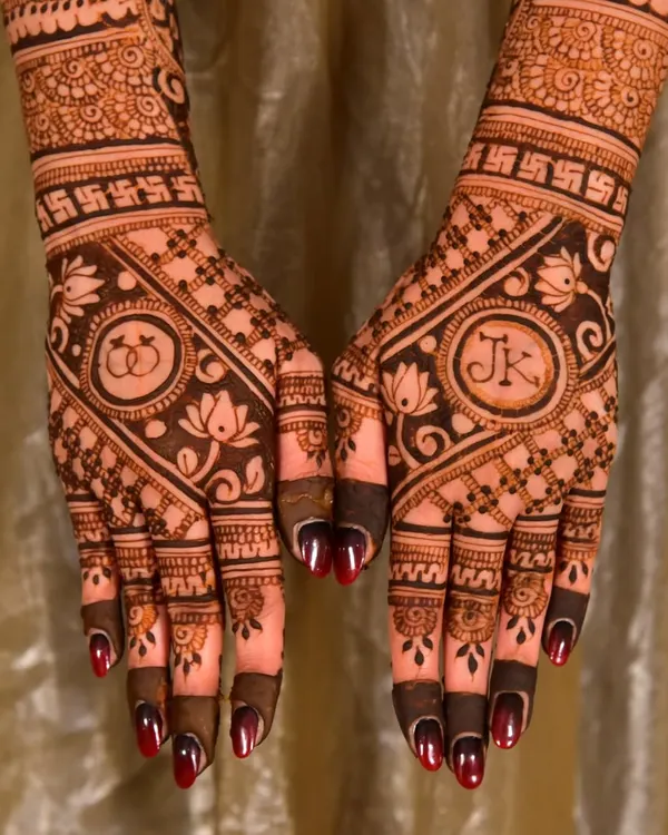 A perfect example of a personalized engagement design, featuring the couple's initials "JK" and intertwined rings. I love working with clients to add these meaningful details to their henna.